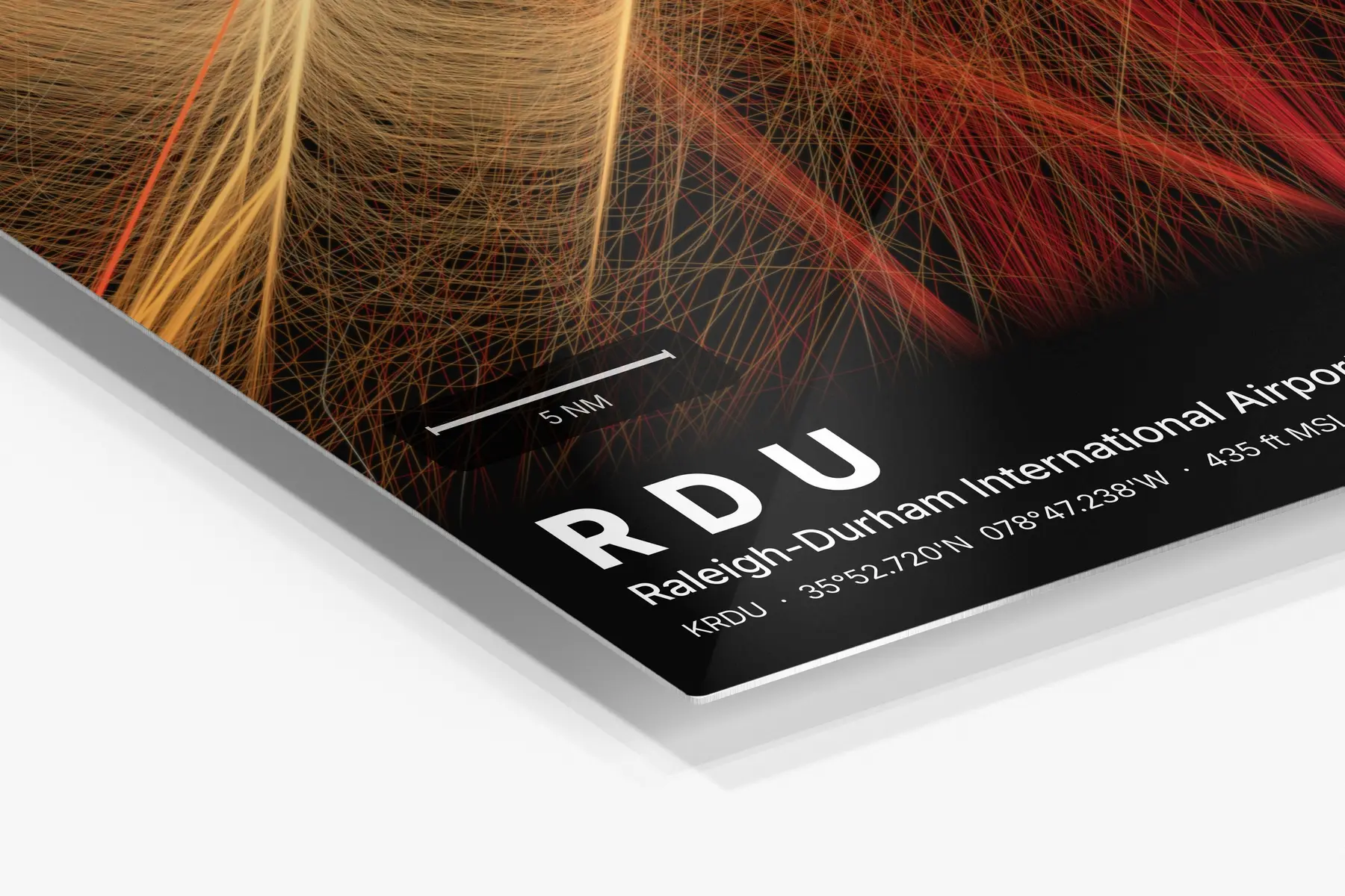 Close-up of the aluminum print's edge and high-gloss finish